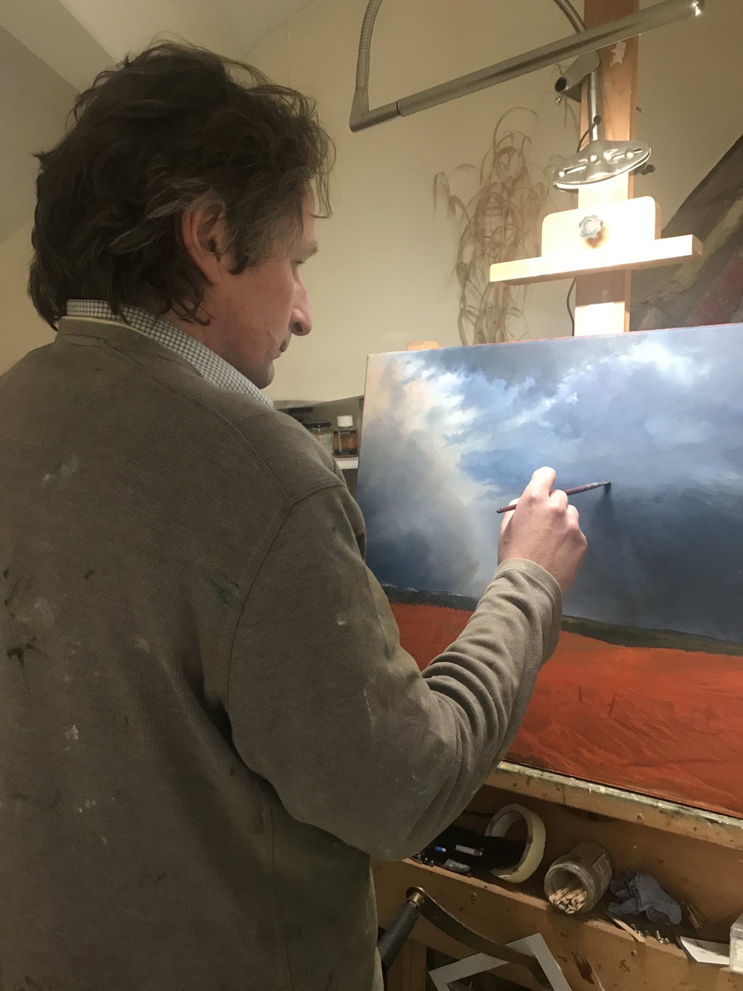 Jonathan Smith painting at the easel
